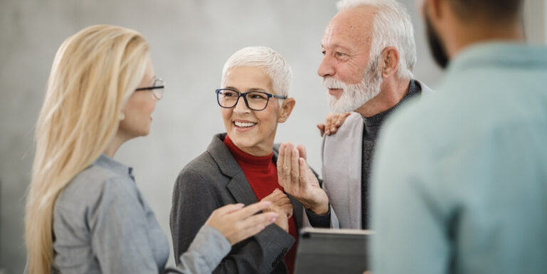 Senior Couple Consulting with Staff About Independent Living Facility Options